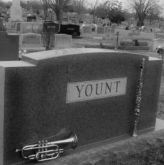 “Sitting on Top of My Dad’s Tombstone” — a poem by Alan Yount